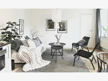 Ilustracja artykułu wygodny fotel, praktyczny kredens i jasne kolory, czyli salon w nowoczesnym wydaniu